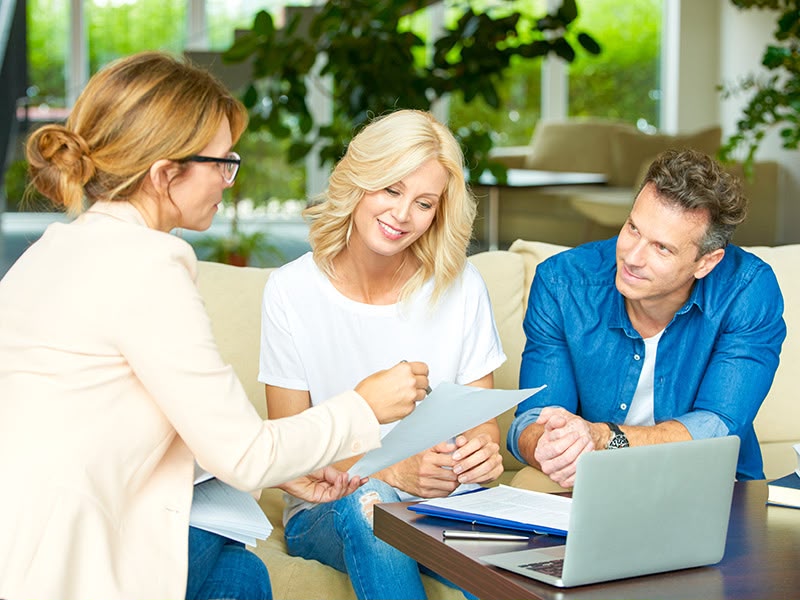 Mortgage adviser reviewing options with clients